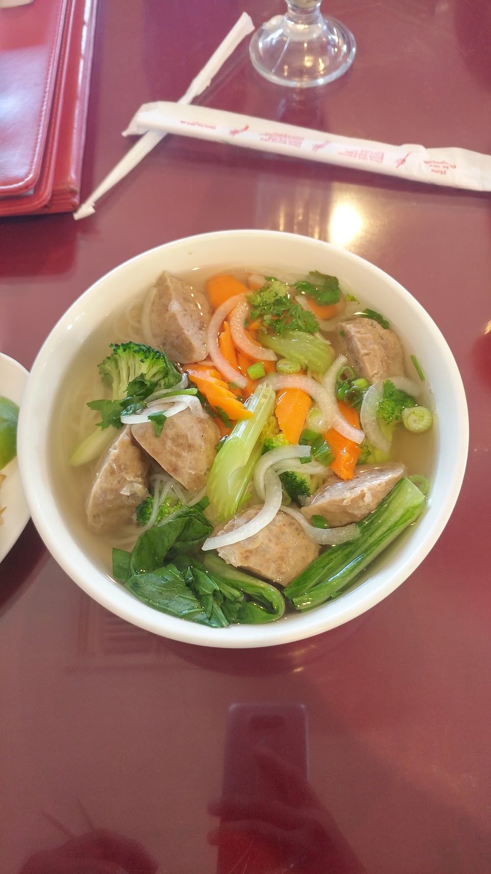Printed menu with Vietnamese specialties.
